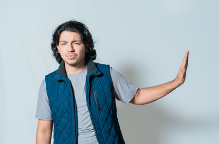 Young man rejecting with palms hands isolated. Person making rejection gesture isolated, He frowns