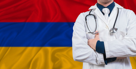 Male doctor with stethoscope on Armenia flag. Doctor holding stethoscope on Armenia flagの写真素材