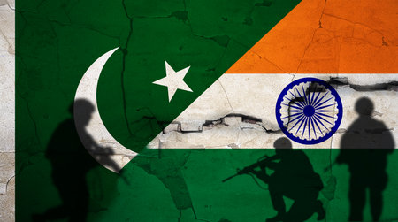 Pakistan vs India flag on cracked wall. Conflict between India and Pakistan concept. Political tension between India and Pakistanの写真素材