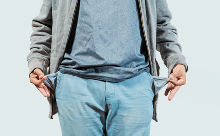Closeup of person with empty pockets isolated. Concept of poverty and economic crisisの写真素材