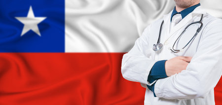 Chile healthcare concept. Male doctor on Chile flag. Doctor with crossed arms on Chile flagの写真素材