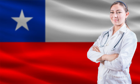 Female doctor on Chile flag. Doctor with crossed arms on Chile flag. Chile health and care conceptの写真素材