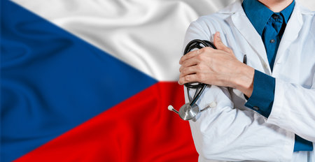 Doctor with stethoscope on Czech Republic flag. Doctor holding stethoscope on Czech Republic flagの写真素材