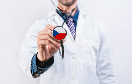 Czech Republic healthcare system, doctor holding stethoscope. Czech Republic health and medical insurance conceptの写真素材