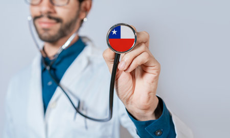 Doctor holding stethoscope with Chile flag. Chile health and care concept, Chile flag on stethoscopeの写真素材