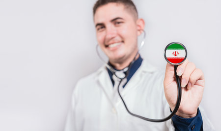 Doctor showing stethoscope with Iran flag. Iran national healthcare conceptの写真素材