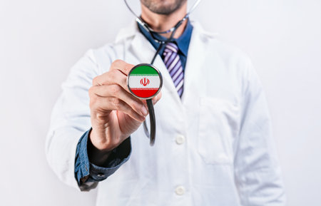 Iran healthcare system, doctor holding stethoscope. Iran health and medical insurance conceptの写真素材