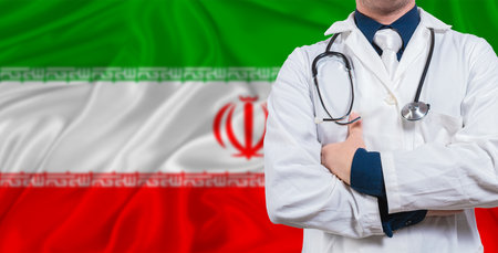 Male doctor with stethoscope on Iran flag. Doctor holding stethoscope on Iran flagの写真素材