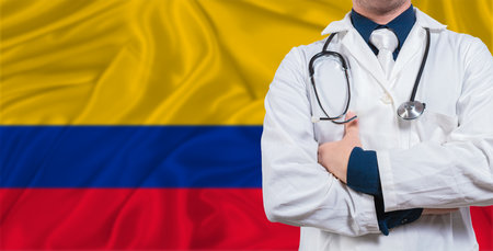 Male doctor with stethoscope on Colombia flag. Doctor holding stethoscope on Colombia flagの写真素材