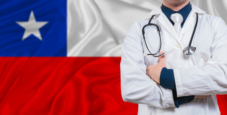 Male doctor with stethoscope on Chile flag. Doctor holding stethoscope on Chile flagの写真素材