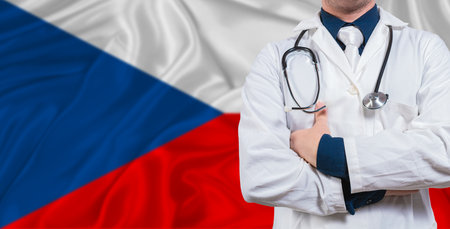 Male doctor with stethoscope on Czech Republic flag. Doctor holding stethoscope on Czech Republic flagの写真素材