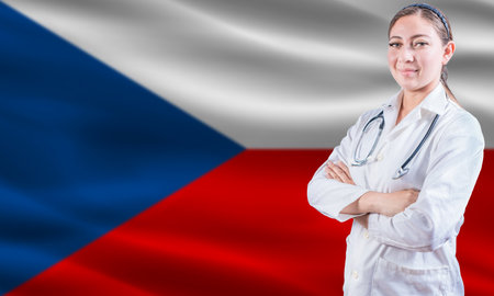 Female doctor on Czech Republic flag. Doctor with crossed arms on Czech Republic flag. Czech Republic health and care conceptの写真素材