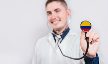 Doctor showing stethoscope with Colombia flag. Colombia national healthcare conceptの写真素材