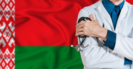 Doctor with stethoscope on Belarus flag. Doctor holding stethoscope on Belarus flagの写真素材