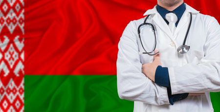 Male doctor with stethoscope on Belarus flag. Doctor holding stethoscope on Belarus flagの写真素材