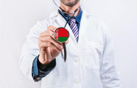Belarus healthcare system, doctor holding stethoscope. Belarus health and medical insurance conceptの写真素材