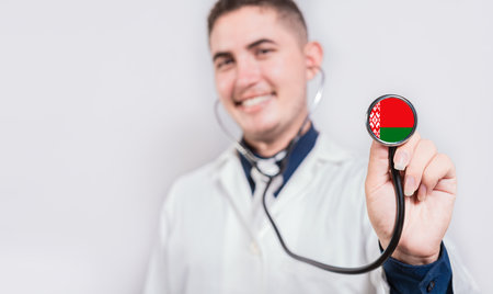 Doctor showing stethoscope with Belarus flag. Belarus national healthcare conceptの写真素材