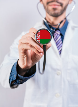Belarus health and medical insurance concept. Belarus healthcare system, doctor holding stethoscopeの写真素材