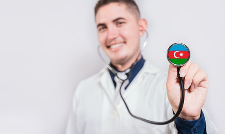 Doctor showing stethoscope with Azerbaijan flag. Azerbaijan national healthcare conceptの写真素材
