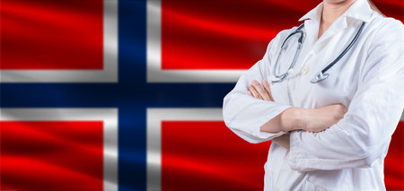 Doctor with crossed arms on Norway flag. Norway health and care concept. Female doctor on Norway flagの写真素材