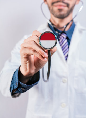 Monaco health and medical insurance concept. Monaco healthcare system, doctor holding stethoscopeの写真素材