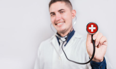 Doctor showing stethoscope with Switzerland flag. Switzerland national healthcare conceptの写真素材