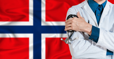 Doctor with stethoscope on Norway flag. Doctor holding stethoscope on Norway flagの写真素材