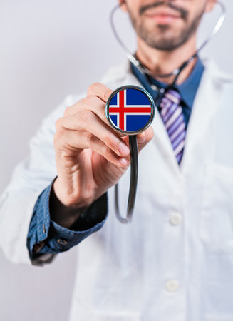 Iceland health and medical insurance concept. Iceland healthcare system, doctor holding stethoscopeの写真素材
