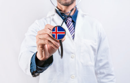 Iceland healthcare system, doctor holding stethoscope. Iceland health and medical insurance conceptの写真素材