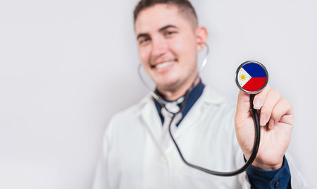 Doctor showing stethoscope with Philippines flag. Philippines national healthcare conceptの写真素材