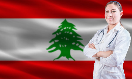 Female doctor on Lebanon flag. Doctor with crossed arms on Lebanon flag. Lebanon health and care conceptの写真素材