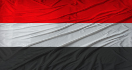 Close up of Yemen flag waving. Flag of Yemen with cloth textureの写真素材