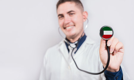 Doctor showing stethoscope with Kuwait flag. Kuwait national healthcare conceptの写真素材