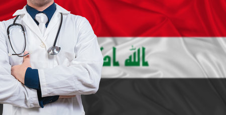 Male doctor with stethoscope on Iraq flag. Doctor holding stethoscope on Iraq flagの写真素材