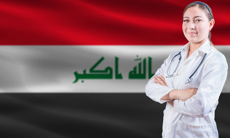 Female doctor on Iraq flag. Doctor with crossed arms on Iraq flag. Iraq health and care conceptの写真素材
