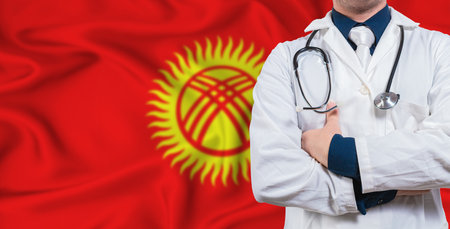 Male doctor with stethoscope on Kyrgyzstan flag. Doctor holding stethoscope on Kyrgyzstan flagの写真素材