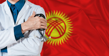 Doctor with stethoscope on Kyrgyzstan flag. Doctor holding stethoscope on Kyrgyzstan flagの写真素材