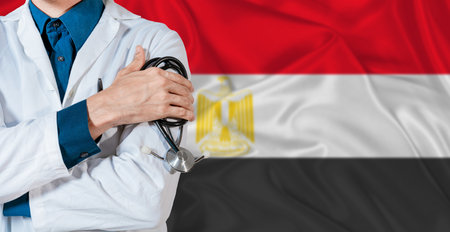 Doctor with stethoscope on Egypt flag. Doctor holding stethoscope on Egypt flagの写真素材