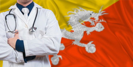 Male doctor with stethoscope on Bhutan flag. Doctor holding stethoscope on Bhutan flagの写真素材