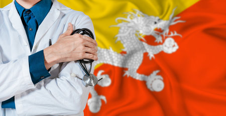 Doctor with stethoscope on Bhutan flag. Doctor holding stethoscope on Bhutan flagの写真素材
