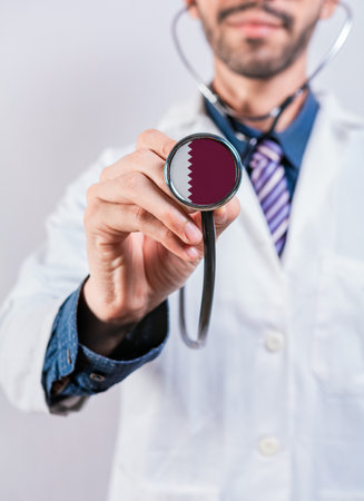 Qatar health and medical insurance concept. Qatar healthcare system, doctor holding stethoscope