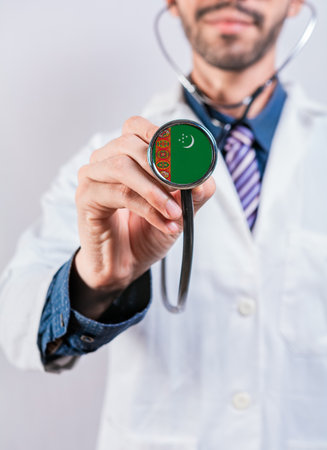Turkmenistan health and medical insurance concept. Turkmenistan healthcare system, doctor holding stethoscopeの写真素材