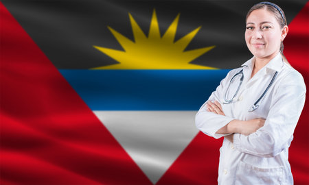 Female doctor on Antigua and Barbuda flag. Doctor with crossed arms on Antigua and Barbuda flag....