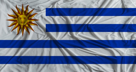 Uruguayan flag with fabric texture background. National flag of Uruguayの写真素材