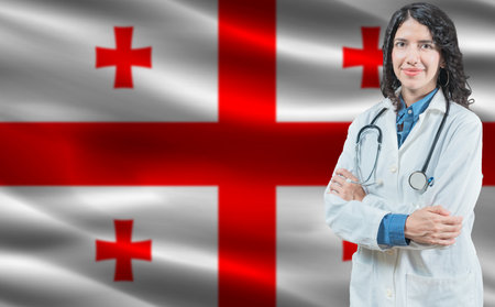 Georgian medicine and healthcare concept. Doctor close up against Georgia flag backgroundの写真素材