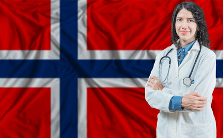 Norwegian medicine and healthcare concept. Doctor close up against Norway flag backgroundの写真素材