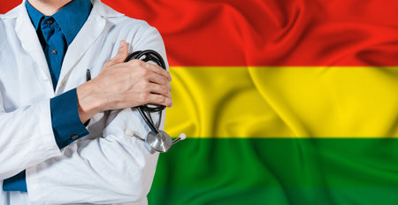 Bolivia healthcare concept. Doctor with stethoscope on Bolivia flag. Doctor holding stethoscope on Bolivian flagの写真素材