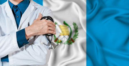 Guatemala healthcare concept. Doctor with stethoscope on Guatemala flag. Doctor holding stethoscope on Guatemalan flagの写真素材