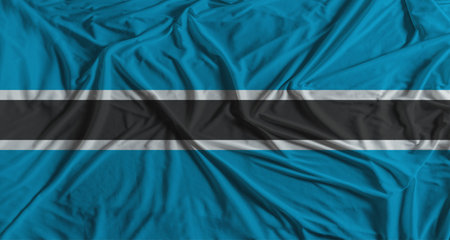 Botswanan flag with fabric texture background. National flag of Botswana with cloth textureの写真素材