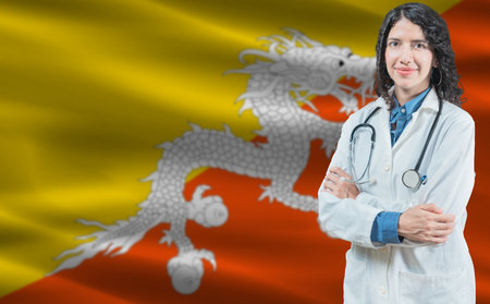 Bhutanese medicine and healthcare concept. Close up of doctor against Bhutan flag backgroundの写真素材